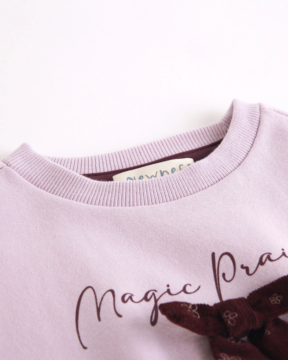 Sweat-shirt doublé polaire, texte et nœud violet